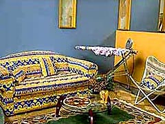 The House of Aboriginality’s lounge room – 100% furnished with pseudo-Aboriginal goods.