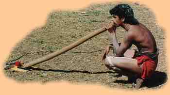 an Aboriginal didgeridoo player at a traditional ceremony